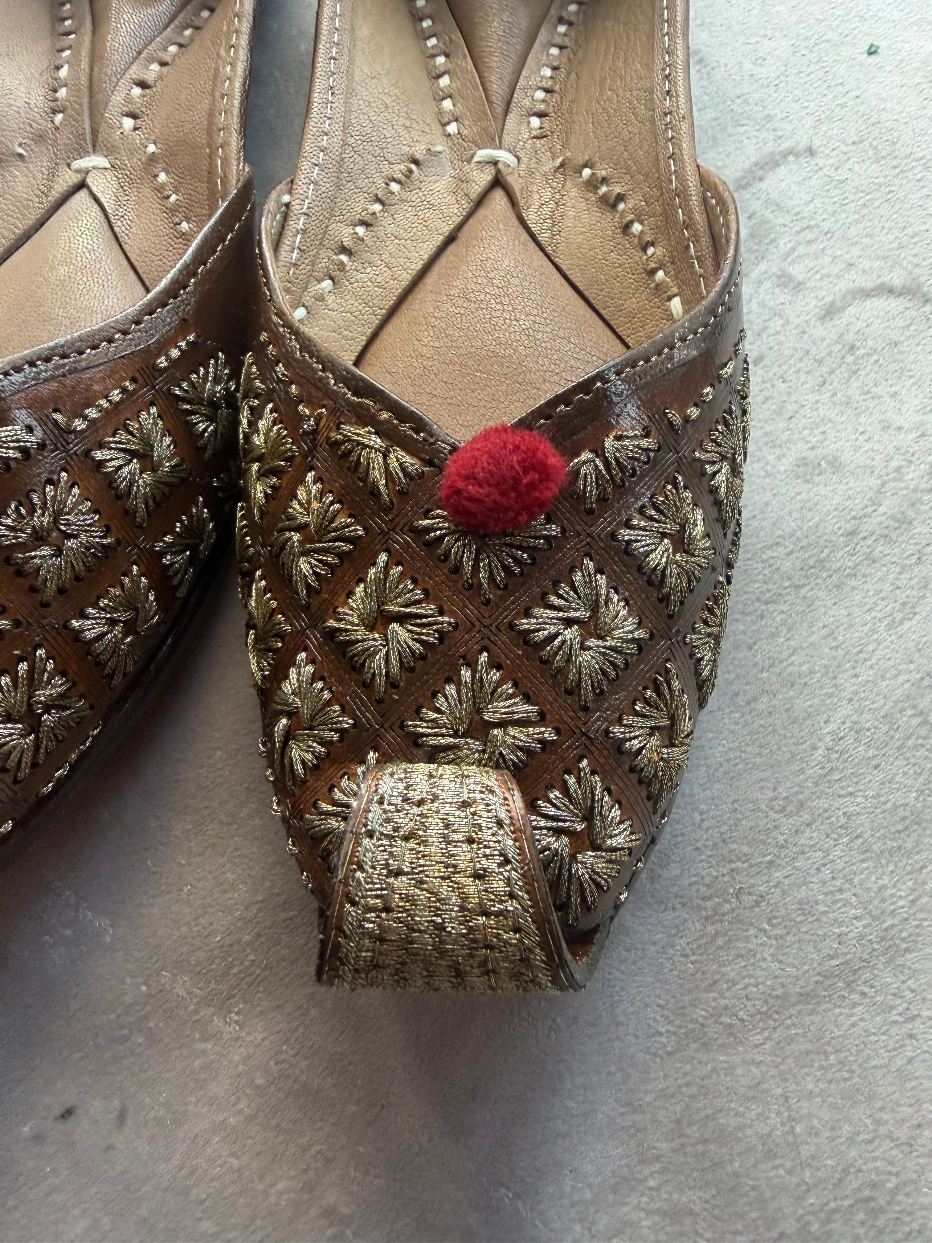 Gold Embroidered Punjabi Jutti – Brown Leather with Red Pom Pom